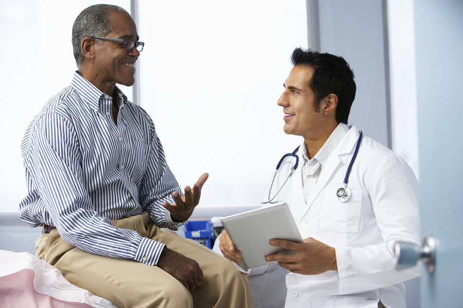 Doctor talking to patient about electronic health records